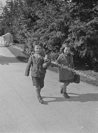 BROTHER AND SISTER ON COUNTRY ROAD